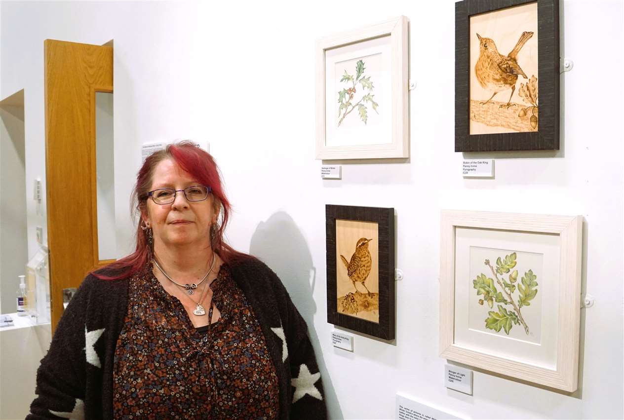 Penny Irvine with four works related to the winter theme. Picture: DGS