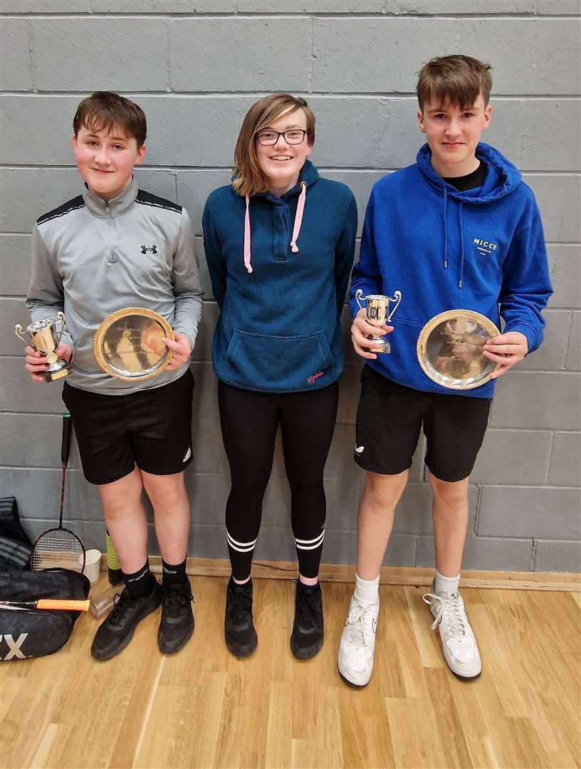 Boys' doubles winners Lewis Malcolm and Alexander Mackay with Chloe Mackenzie from Highland Workwear.