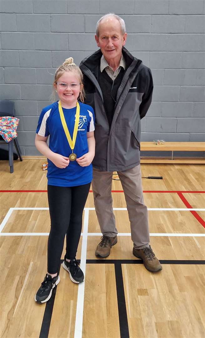 U11 girls' consolation winner April Steven with tournament sponsor Ronald Mackay.