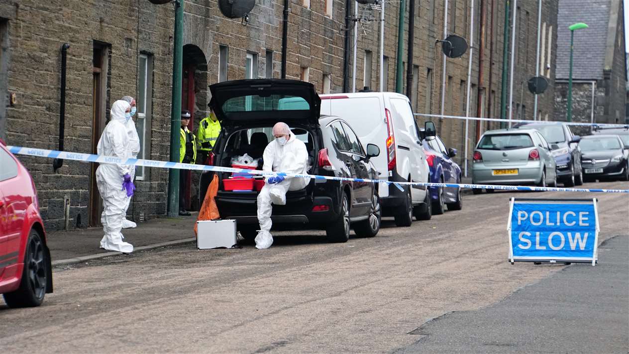 Police attending the scene at Wick's Barrogill Street on Sunday. Picture: DGS