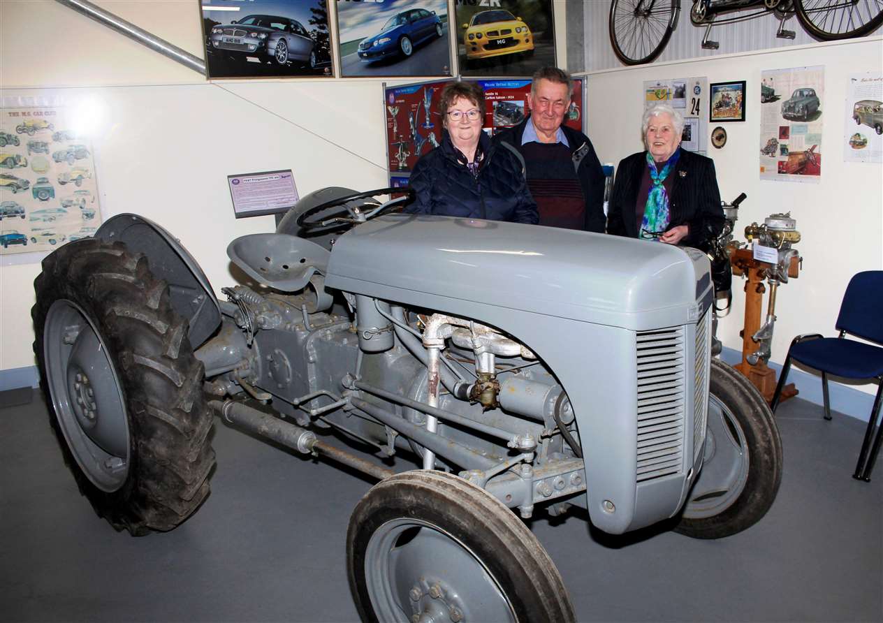 Three of the guests beside the Fergie tractor.