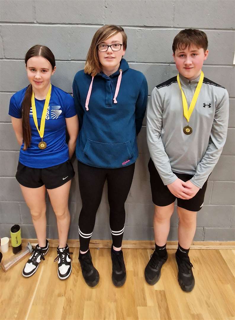 Mixed doubles consolation winners Carla Edwards and Lewis Malcolm with Chloe Mackenzie.