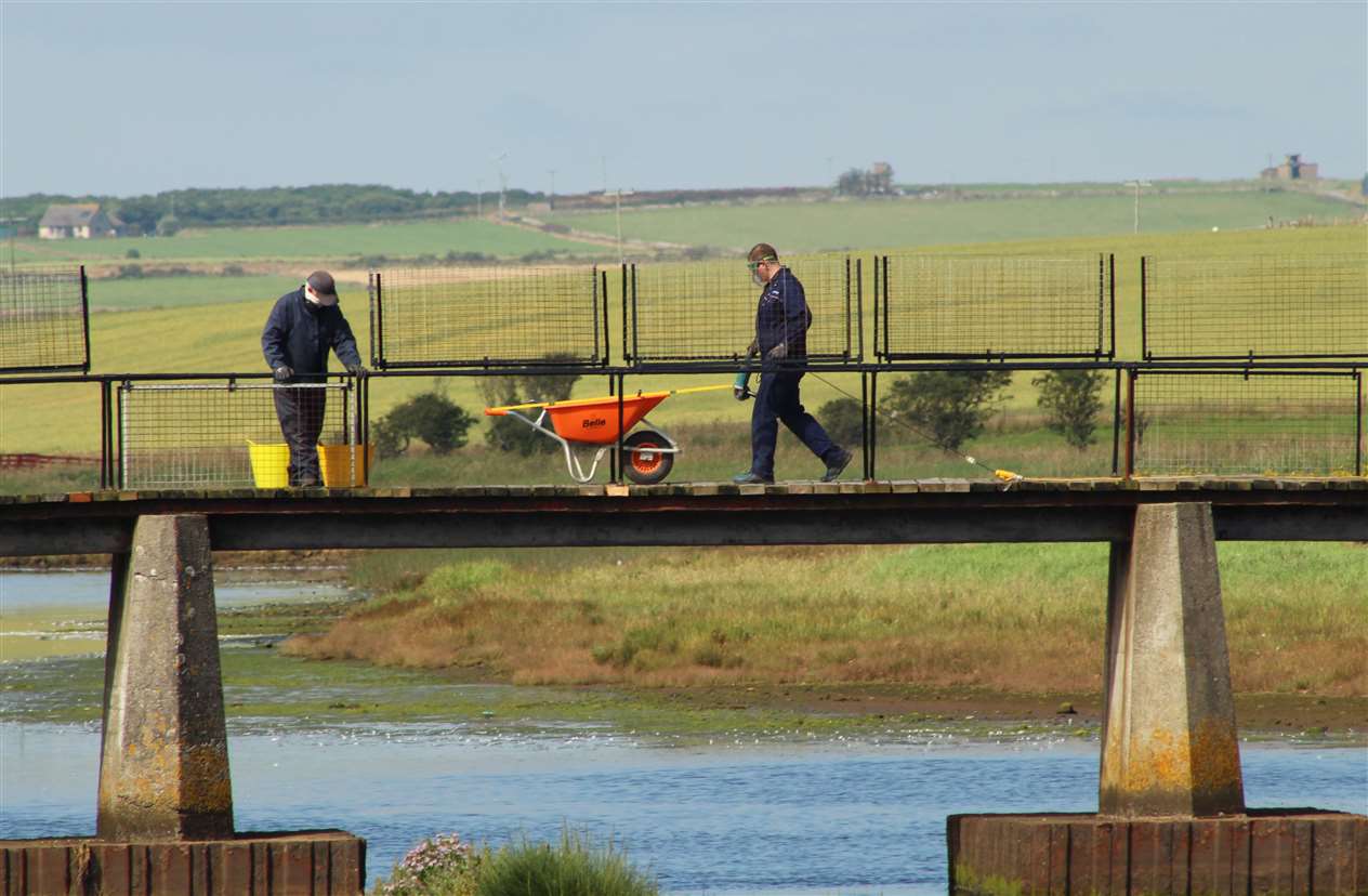 Two of the volunteers getting on with the upgrading work on Saturday morning. Picture: Alan Hendry