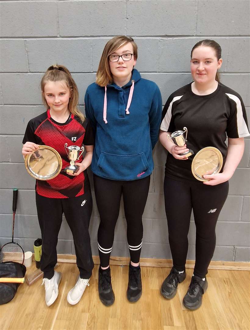 Girls' doubles winners Ava Cook and Freya Swanson with Chloe Mackenzie from Highland Workwear.