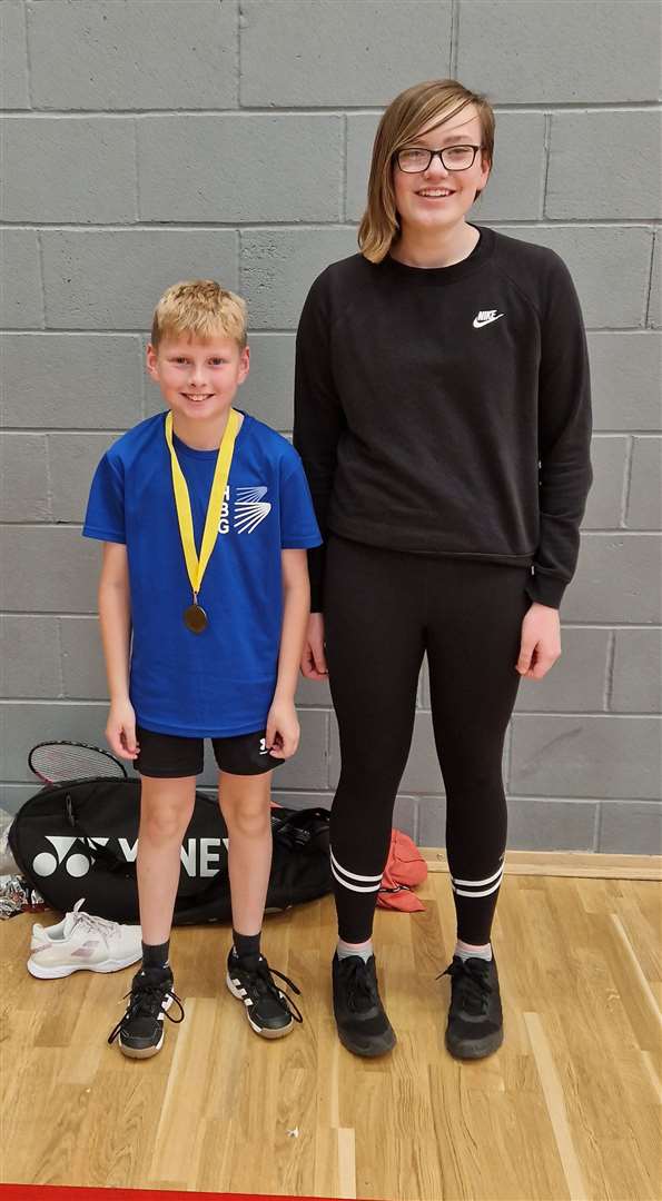 U13 boys' singles consolation Winner Liam Sinclair with Chloe Mackenzie from Highland Workwear.
