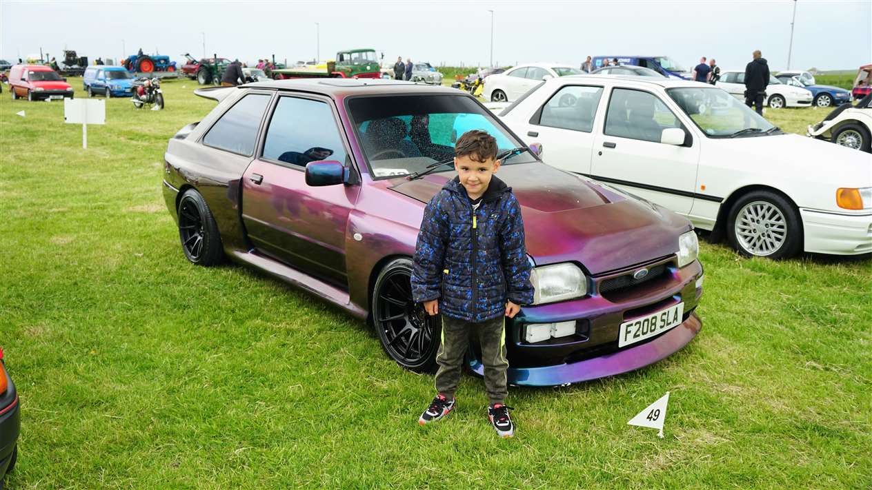 Kieren stands beside a 1989 Ford Escort XR3i Camelion owned by Gordy Morrison from Tain. Picture: DGS