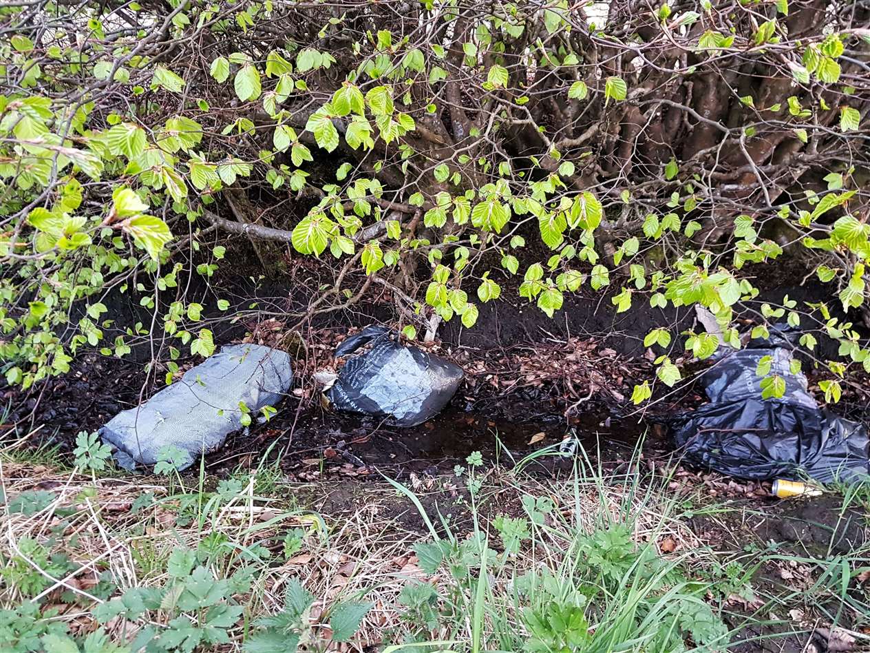 Suspected asbestos sheets and other rubbish dumped in a ditch between Lyth and Keiss. Picture: Donna Mather