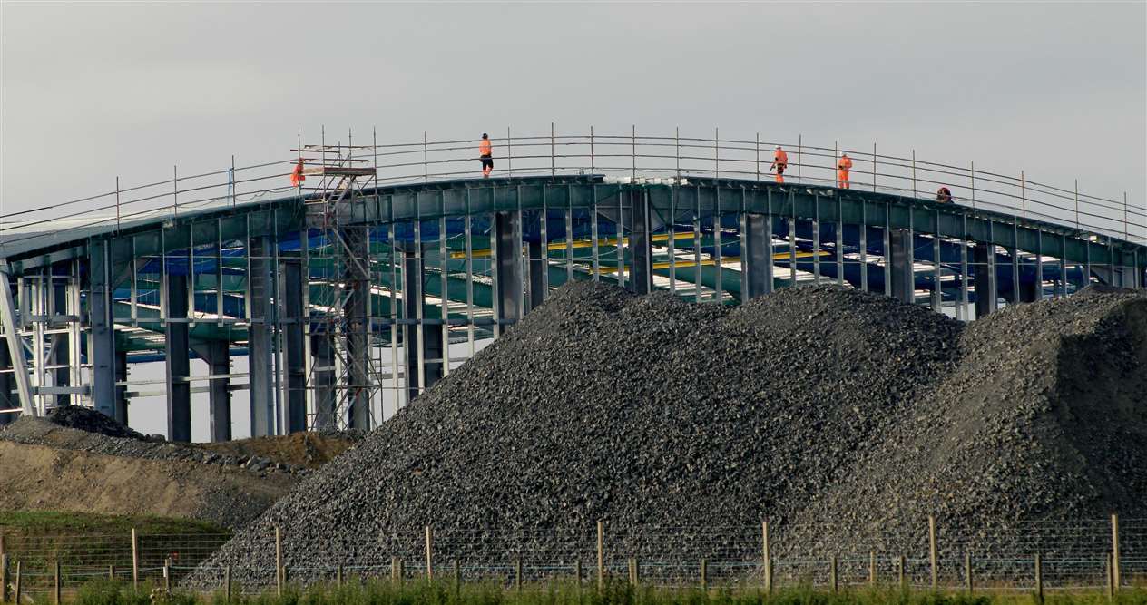 Workers on the roof of the massive structure. Picture: Alan Hendry