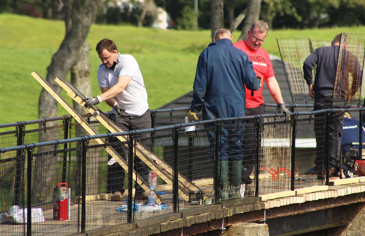 Preparing to replace some of the old deck timbers on the main Coghill footbridge.