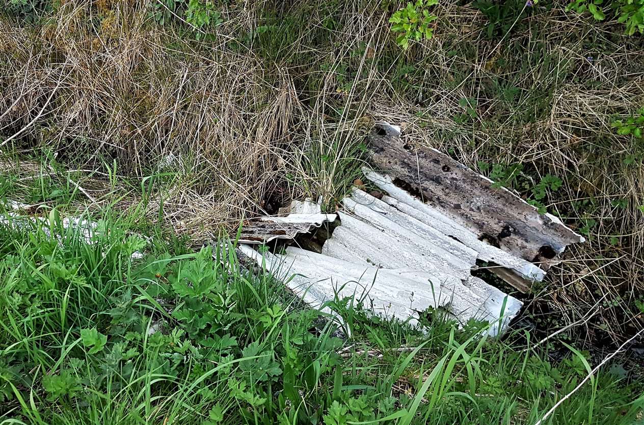 Suspected asbestos sheets and other rubbish dumped in a ditch between Lyth and Keiss. Picture: Donna Mather
