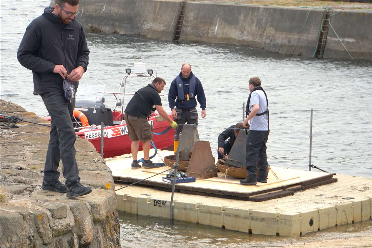 Some of the crew members working on a specially built pontoon in Keiss harbour for use in The Crown episode about the assassination of Lord Mountbatten. Pictures: DGS