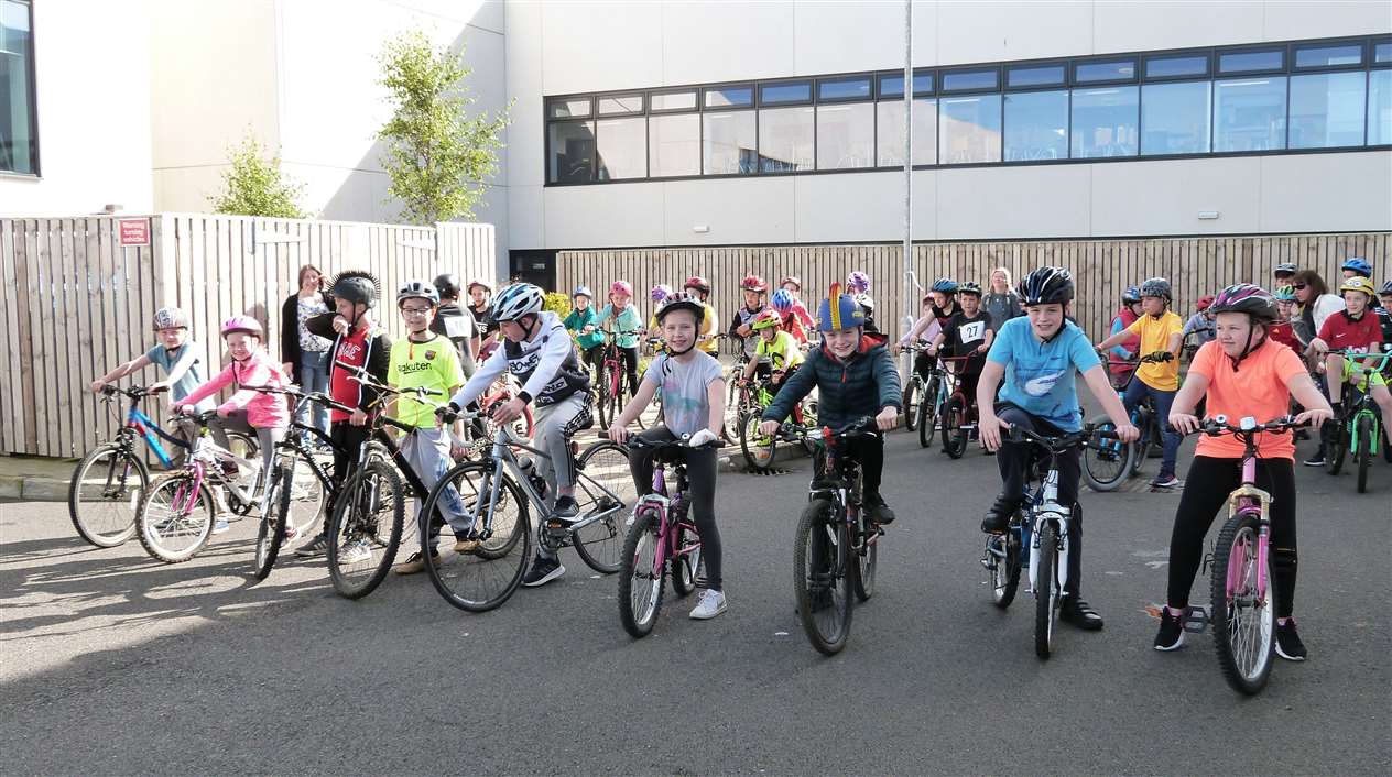 Junior triathlon competitors ready to set off on the cycle section of the event.