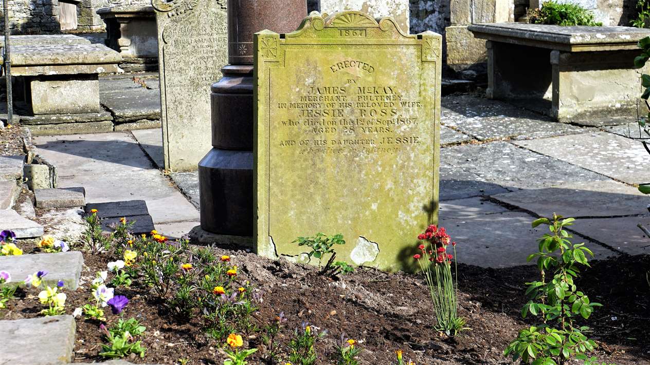 This gravestone was completely covered until shrubs were cut back to reveal it. Pictures: DGS