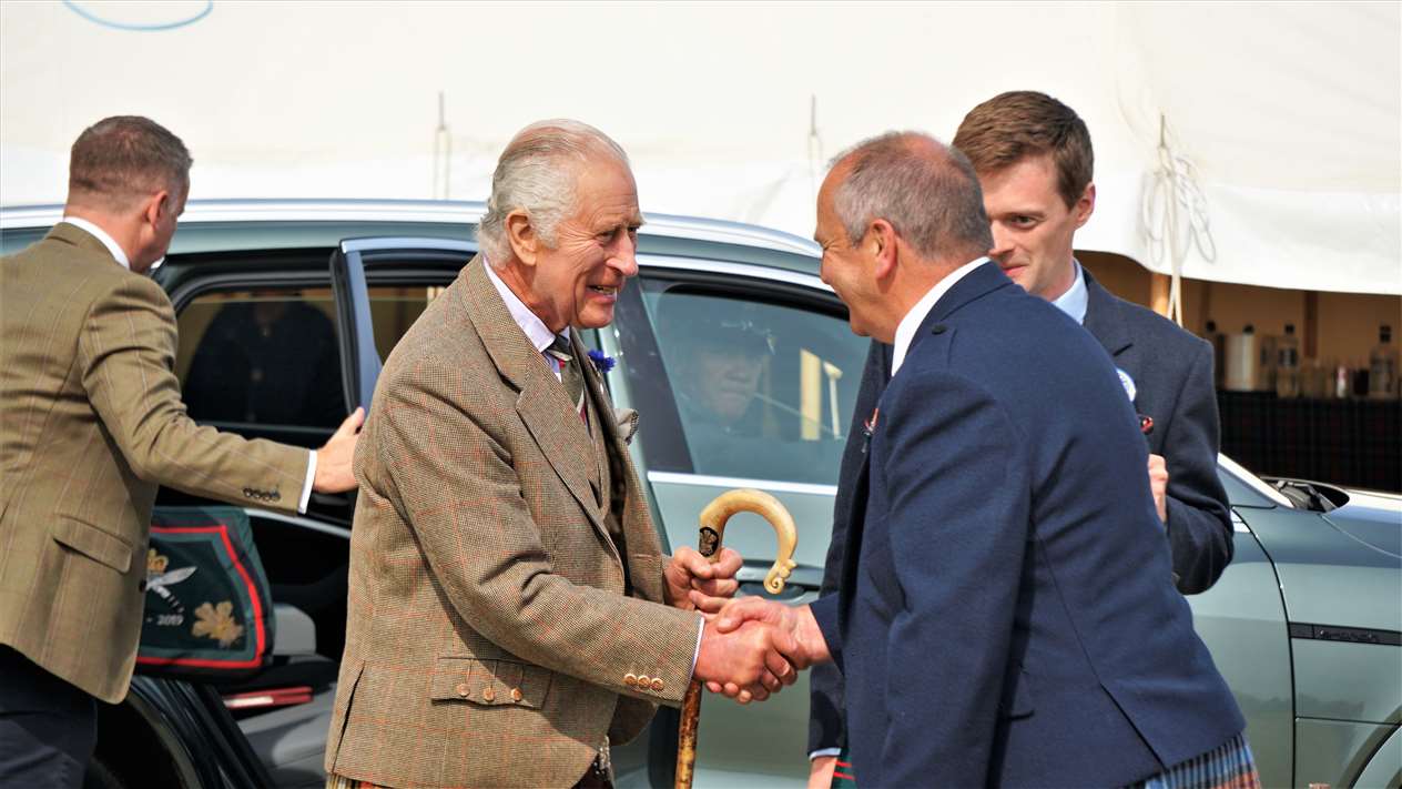 King Charles III is welcomed by ground convenor Henry Gunn. Picture: DGS