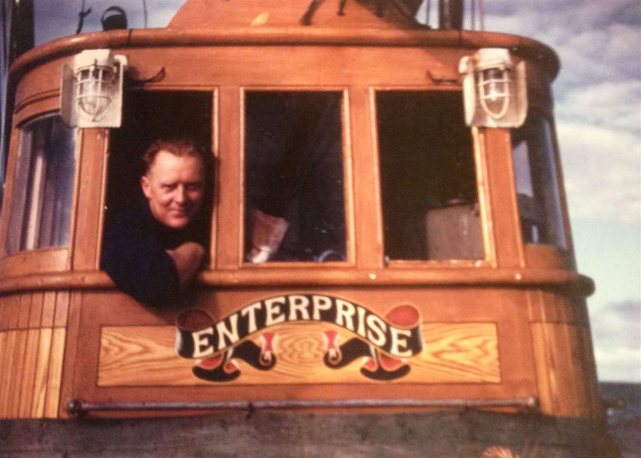 Skipper George Swanson in the wheelhouse of the Enterprise.