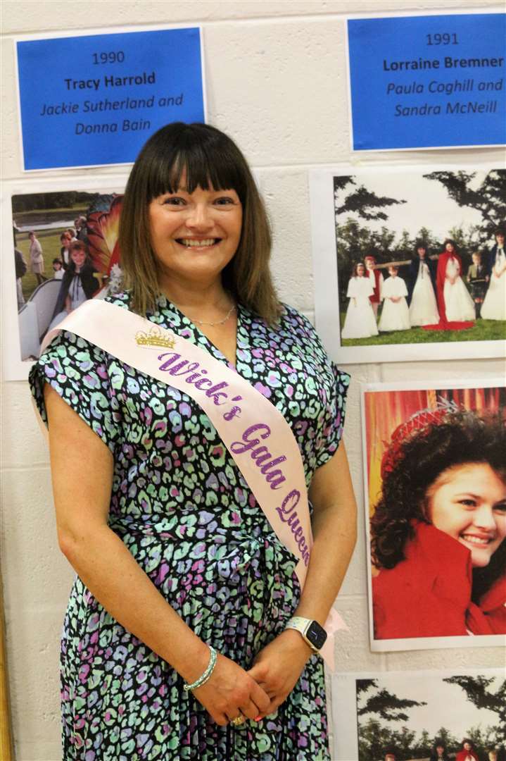 Lorraine Bremner stands beside a picture of herself as the town's Gala Queen in 1991. Picture: Eswyl Fell