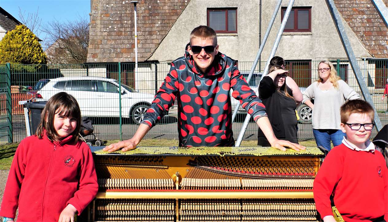 From left, Hannah, James and Callum enjoying the sunshine on Wednesday afternoon.