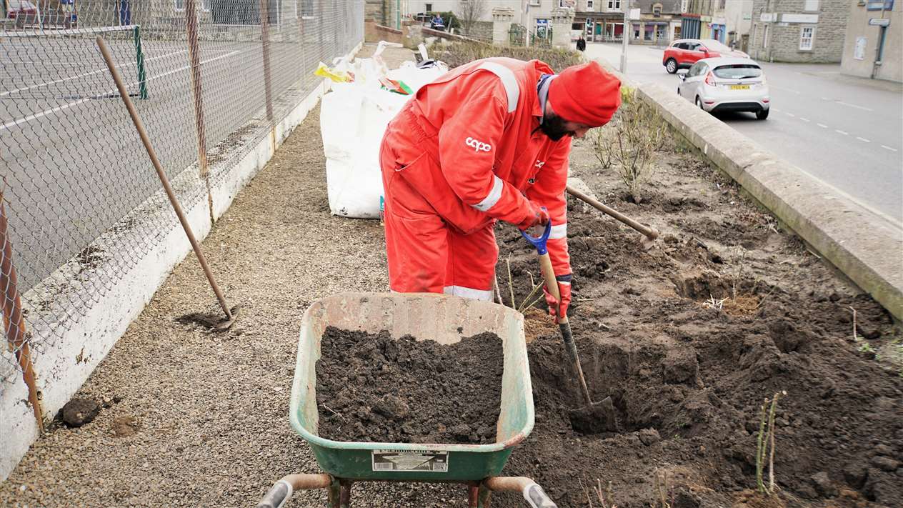Alexander works in the topsoil at the site by Olrig Street in Thurso. Picture: DGS