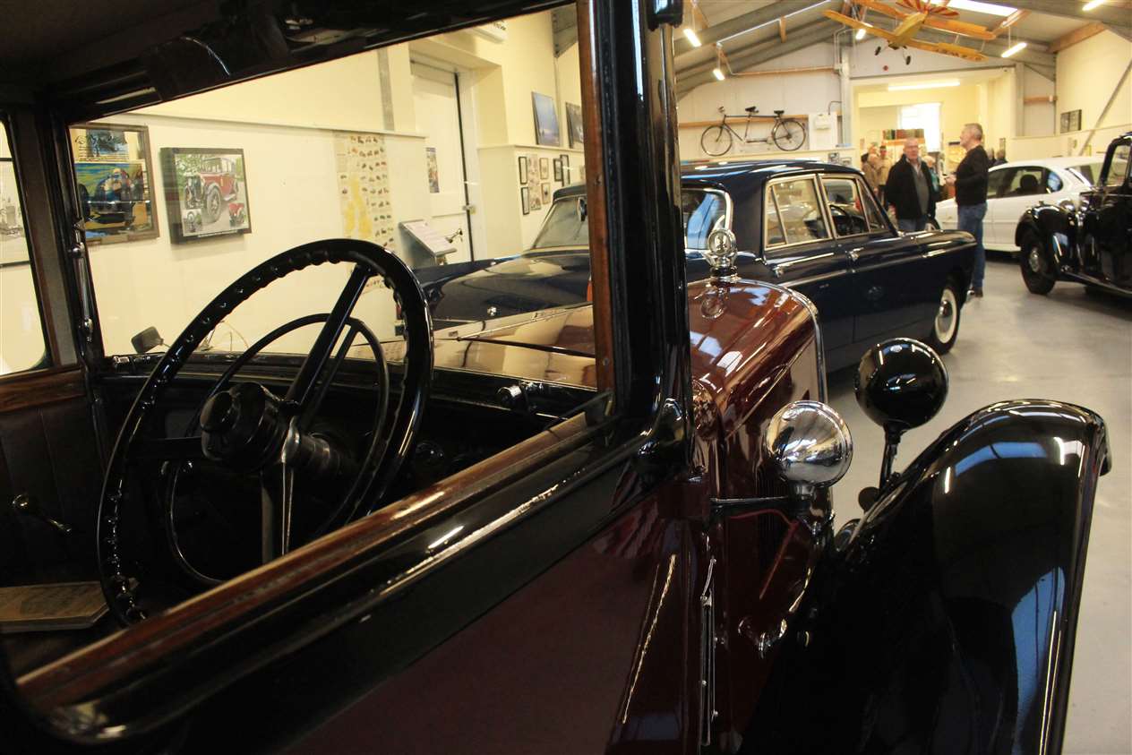 A view through the window of one the vintage cars.