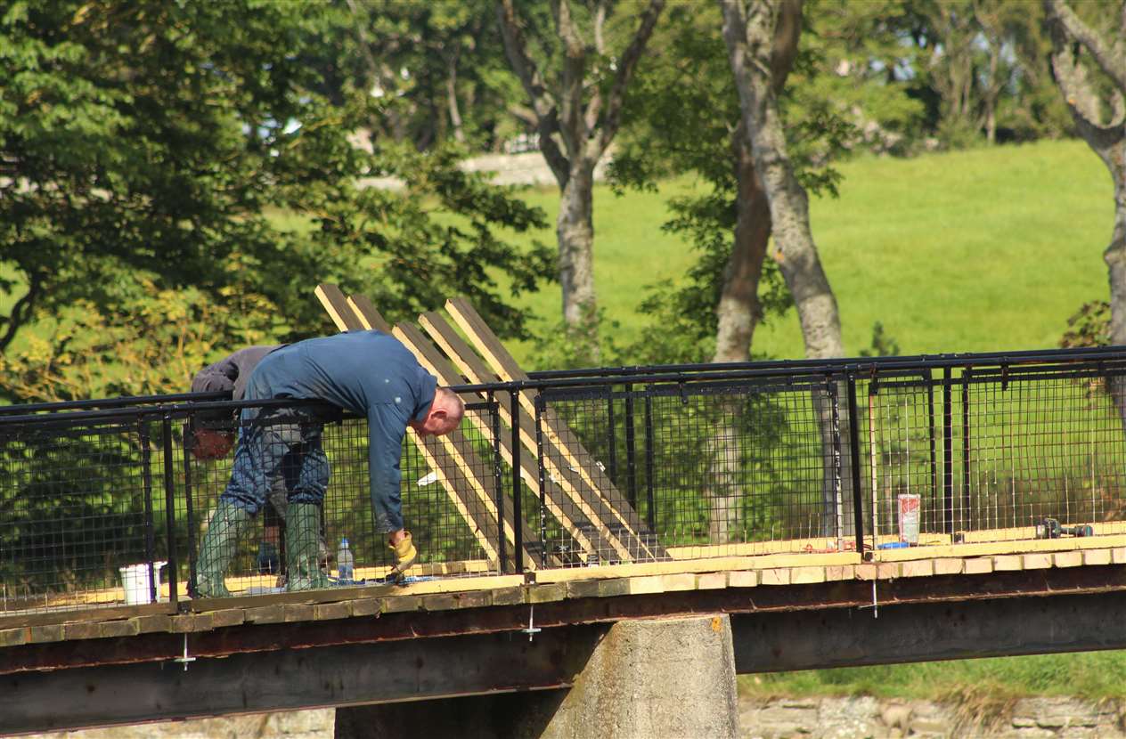 Painting in progress as part of the upgrading of the main bridge.