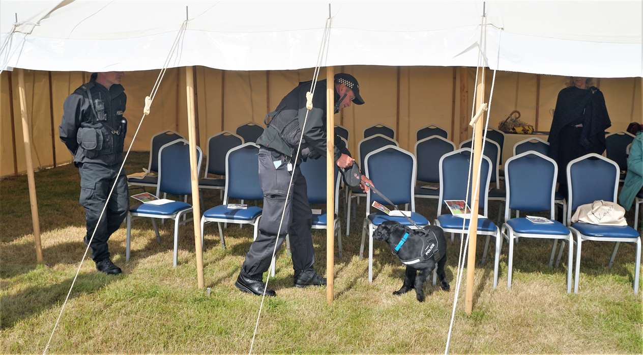 High security was noticeable on the day and police used sniffer dogs to check around the area where the new king would be seated. Picture: DGS