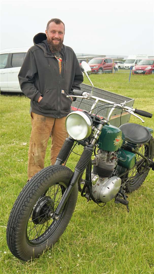 Michael Cragg beside a BSA motorbike he helped restore. Picture: DGS