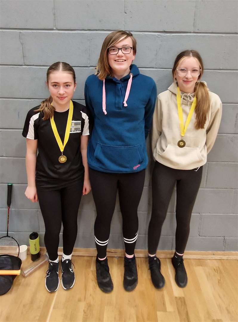 Girls' doubles consolation winners Freya Mackay and Rhea Bruce with Chloe Mackenzie of Highland Workwear.