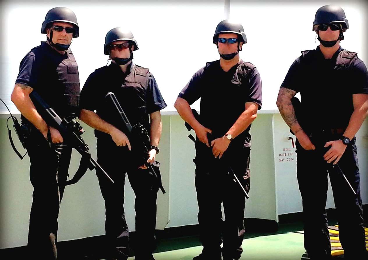 Ronnie has worked with specialist security services in many conflict zones. He is pictured (left) while his colleagues' faces have been disguised to protect their identities.