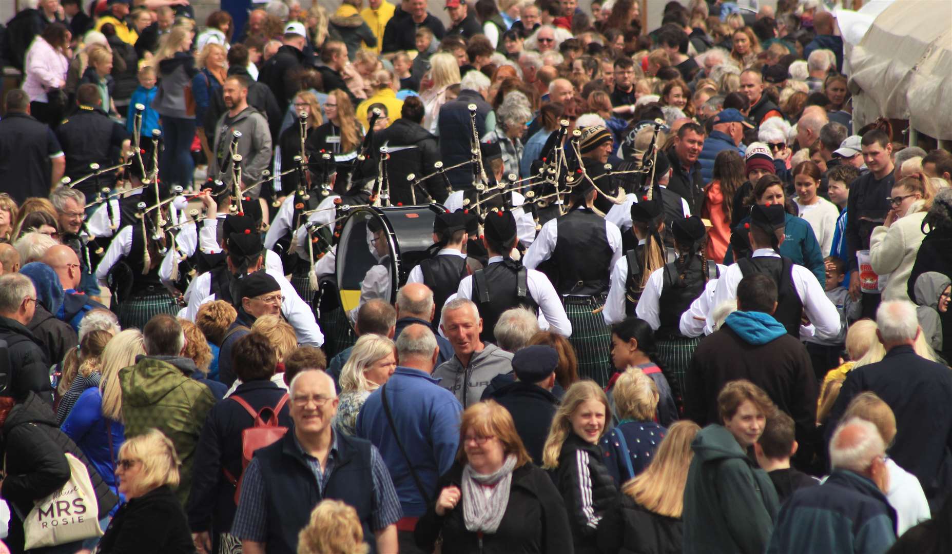 A crowded quayside after a performance by Wick RBLS Pipe Band during the town's first RNLI Harbour Day since 2019. Picture: Alan Hendry
