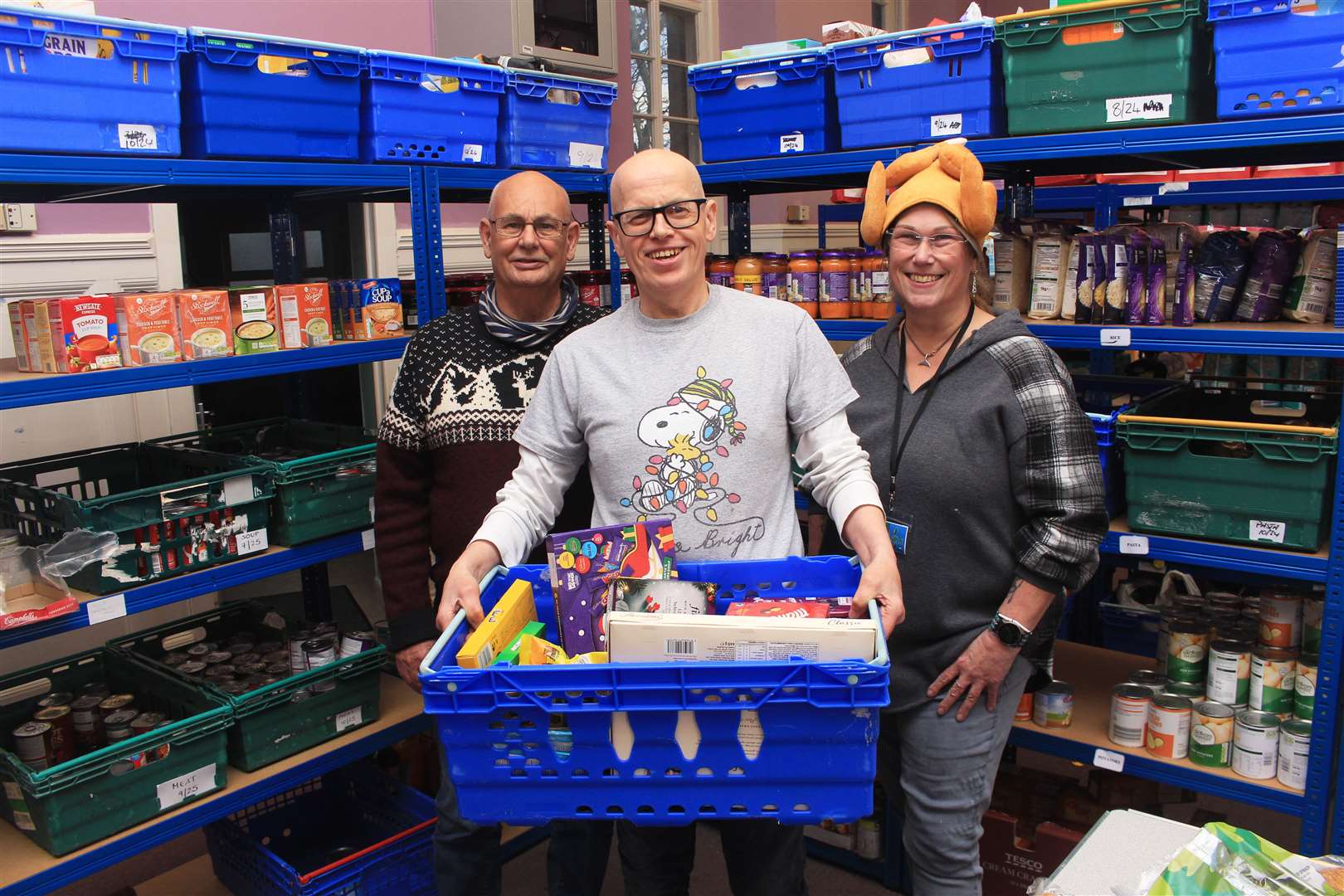 Volunteers Grant Ramsay (left), David Miller and Julia Dunnet at Caithness Foodbank's Wick centre this week. Picture: Alan Hendry