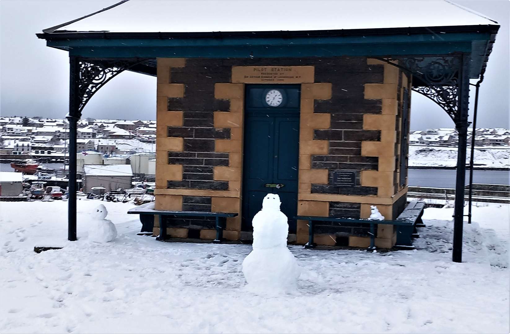 Various snow-people and their dog seen outside Wick's Pilot House. Picture: Derek Bremner