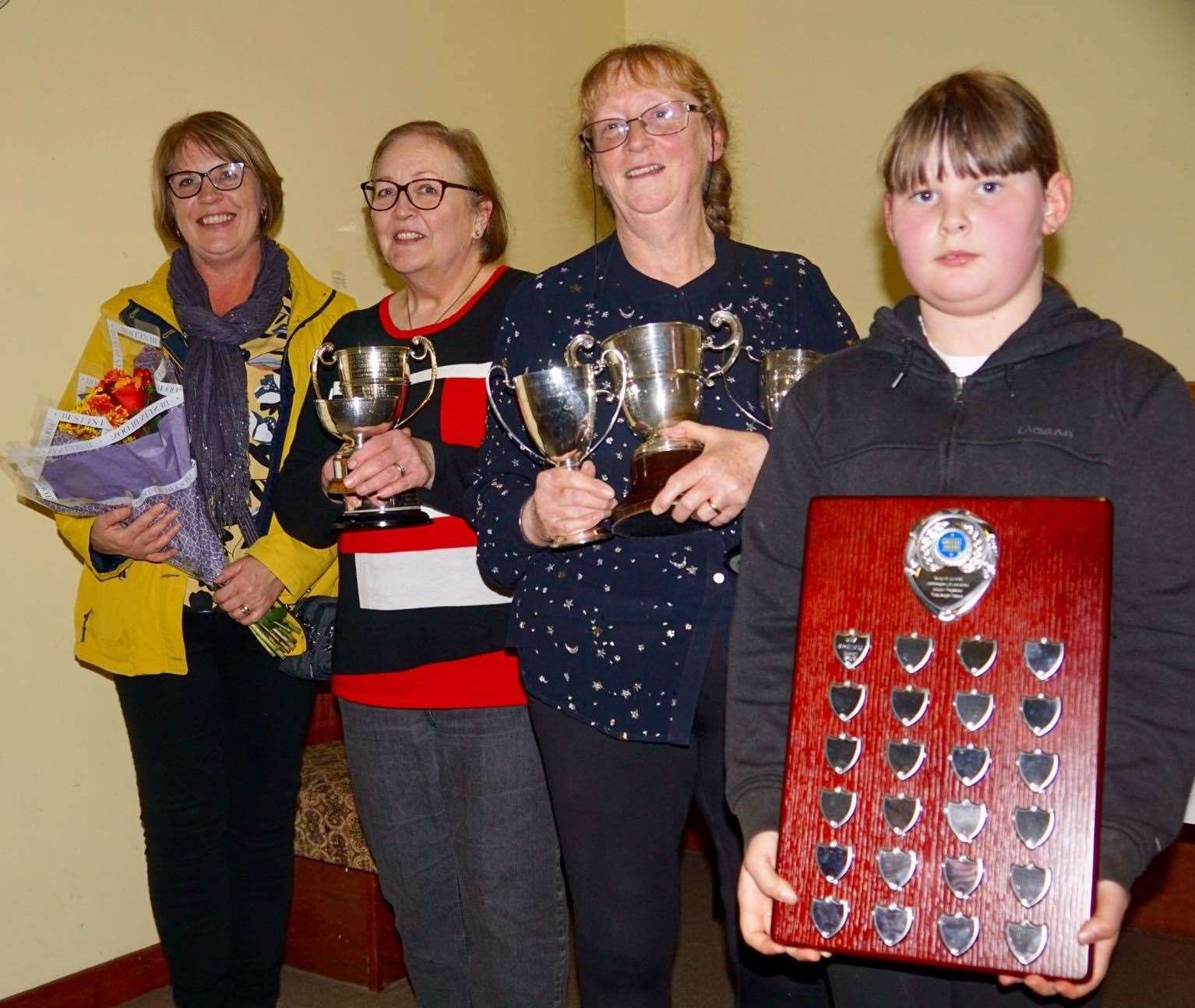 Audrey Mackay (left) presented the trophies to Suzanne Tomlinson, Anne Bertram and Bethany Seddon.