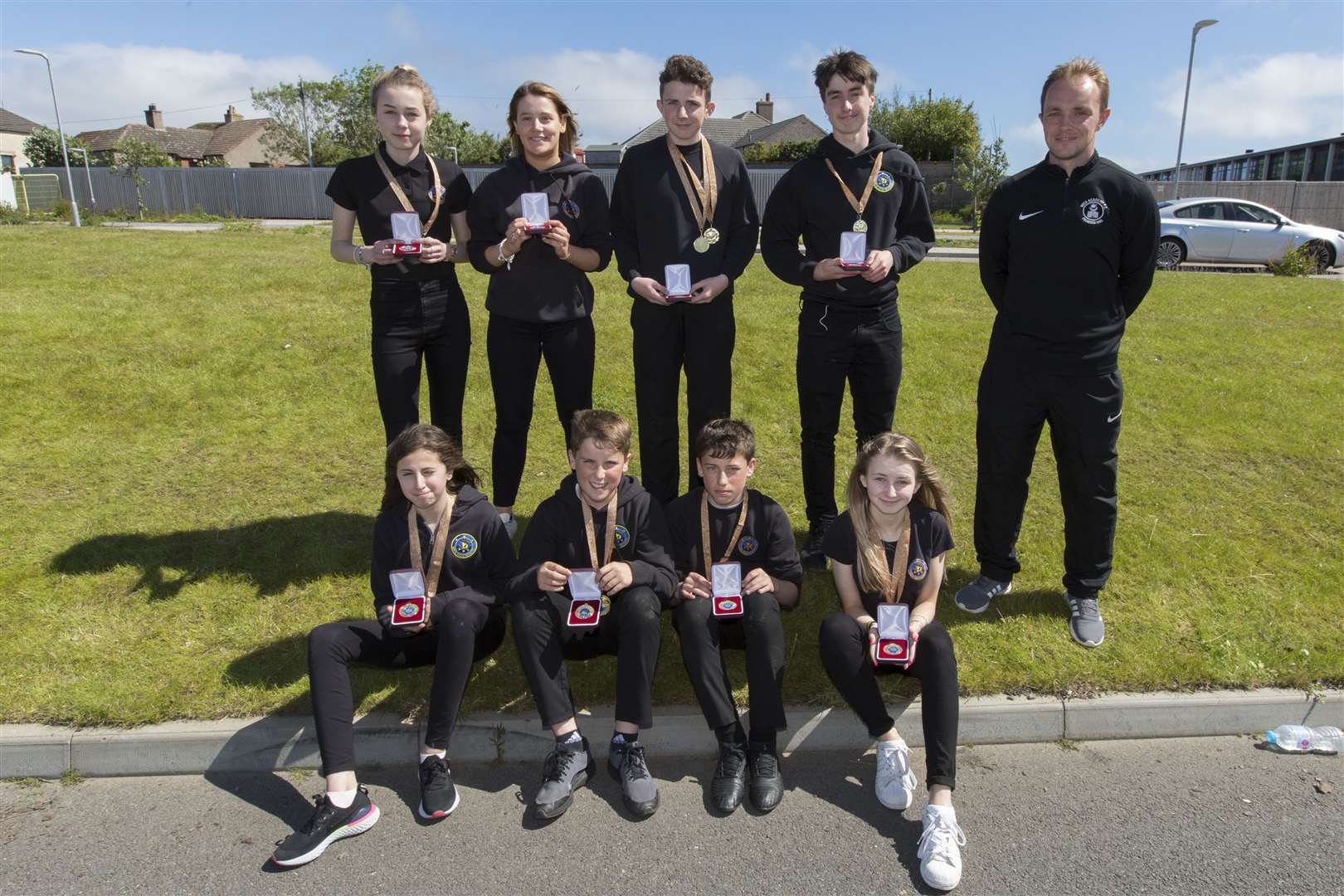 Wick High School's sports pupils of the year pose for a photograph. They are (from left, front) S1 Ellie Salim, Matthew Aitkenhead, S2 Lewis Gill, Kianna Bremner, (back) S3 Anna Swanson, Tashy Cormack, Alan Mathieson, and senior Scott MacDonald. Unable to pick up their awards were Sarah Henstridge from S1 and seniors Shannon Campbell, Kirsty Robertson and Ross Mackay. The awards were handed over by Wick Academy player Richard Macadie. Picture: Robert MacDonald / Northern Studios