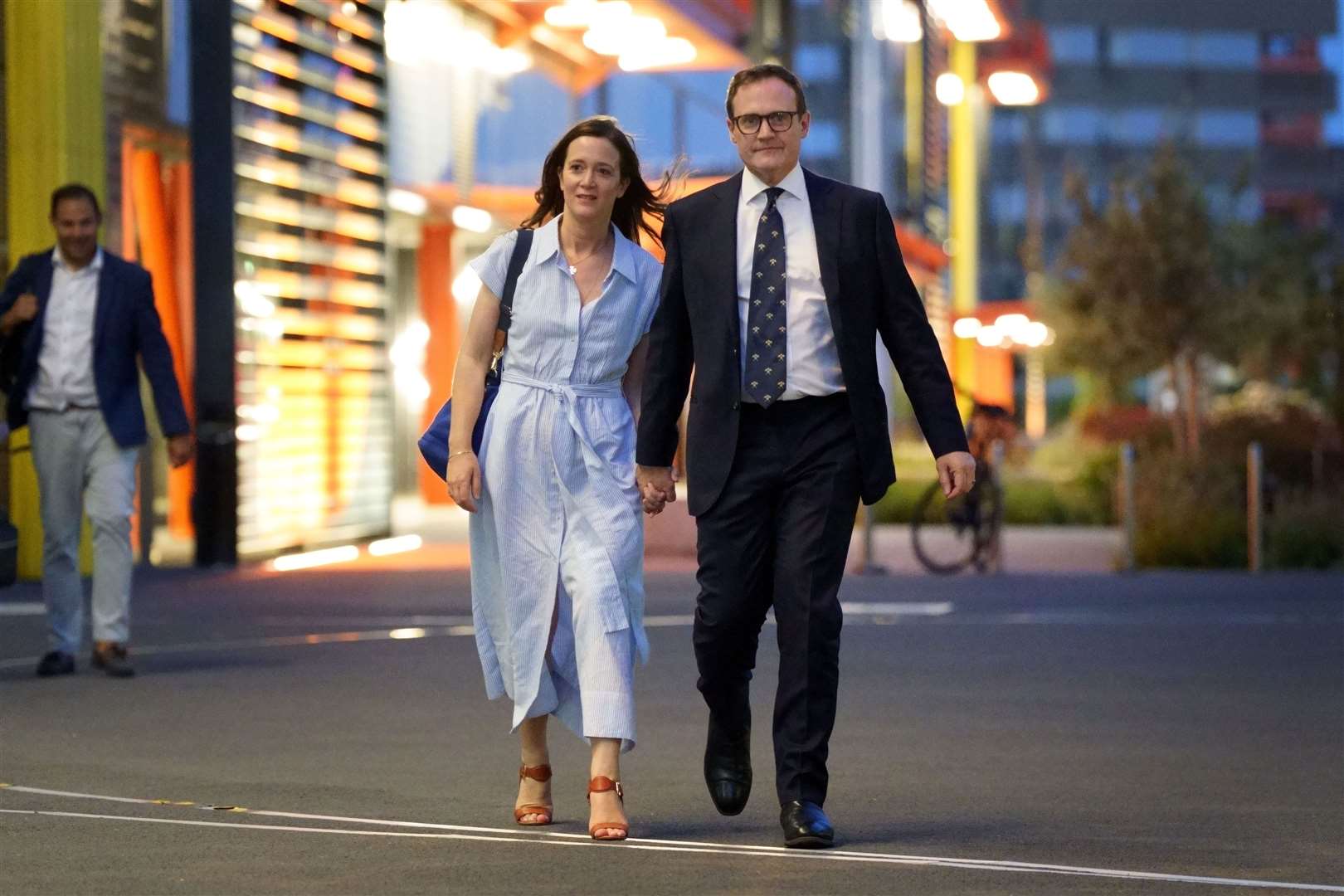 Tom Tugendhat leaves with his wife, Anissia, following the first leadership debate (Victoria Jones/PA)