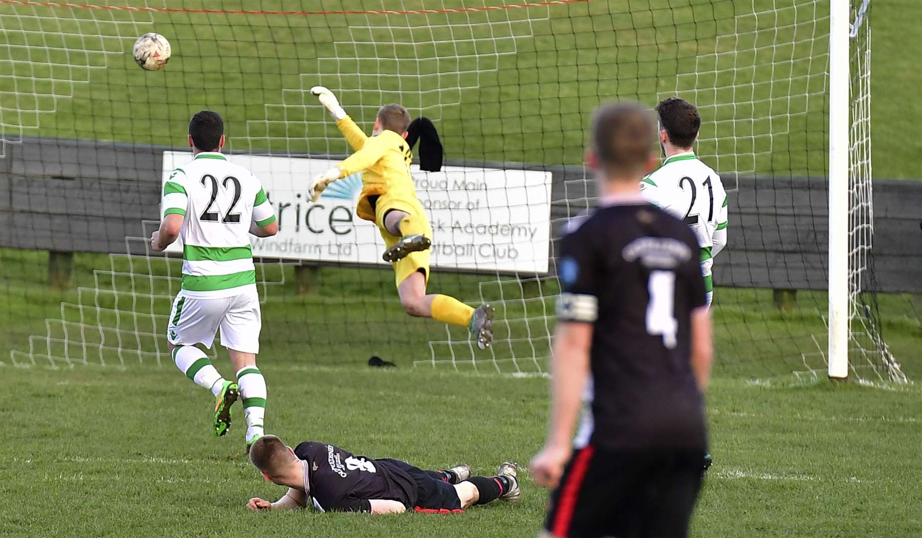 Marc Macgregor (ground) watches as the ball flies past Buckie keeper Lee Herbert for his second goal of the afternoon. Picture: Mel Roger