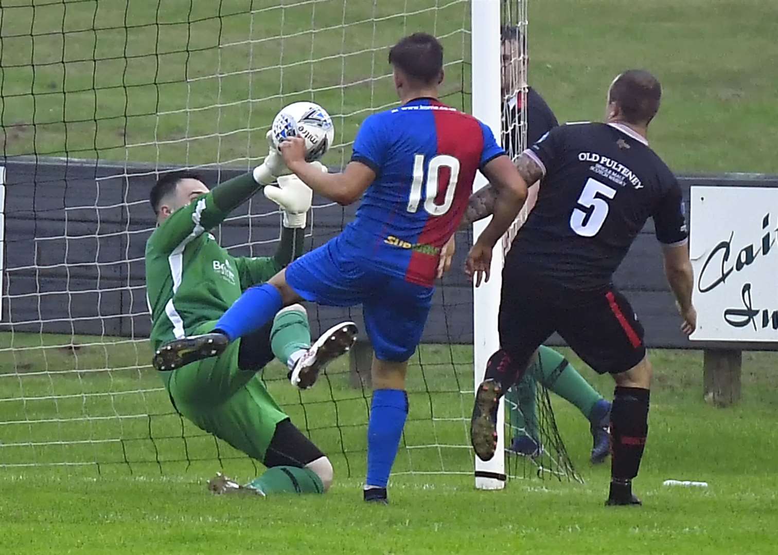 Wick keeper Gordon Clark denies Caley Thistle's Lewis Hyde. Picture: Mel Roger