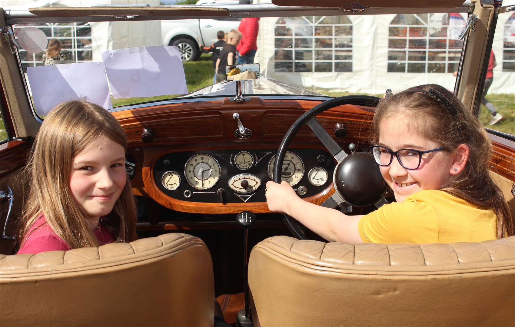 Iona Young (11) from Watten, left, and Morven Plowman (12) from Halkirk in a 1933 Wolseley 25 Coupé, part of the collection of the late Edward Sutherland.