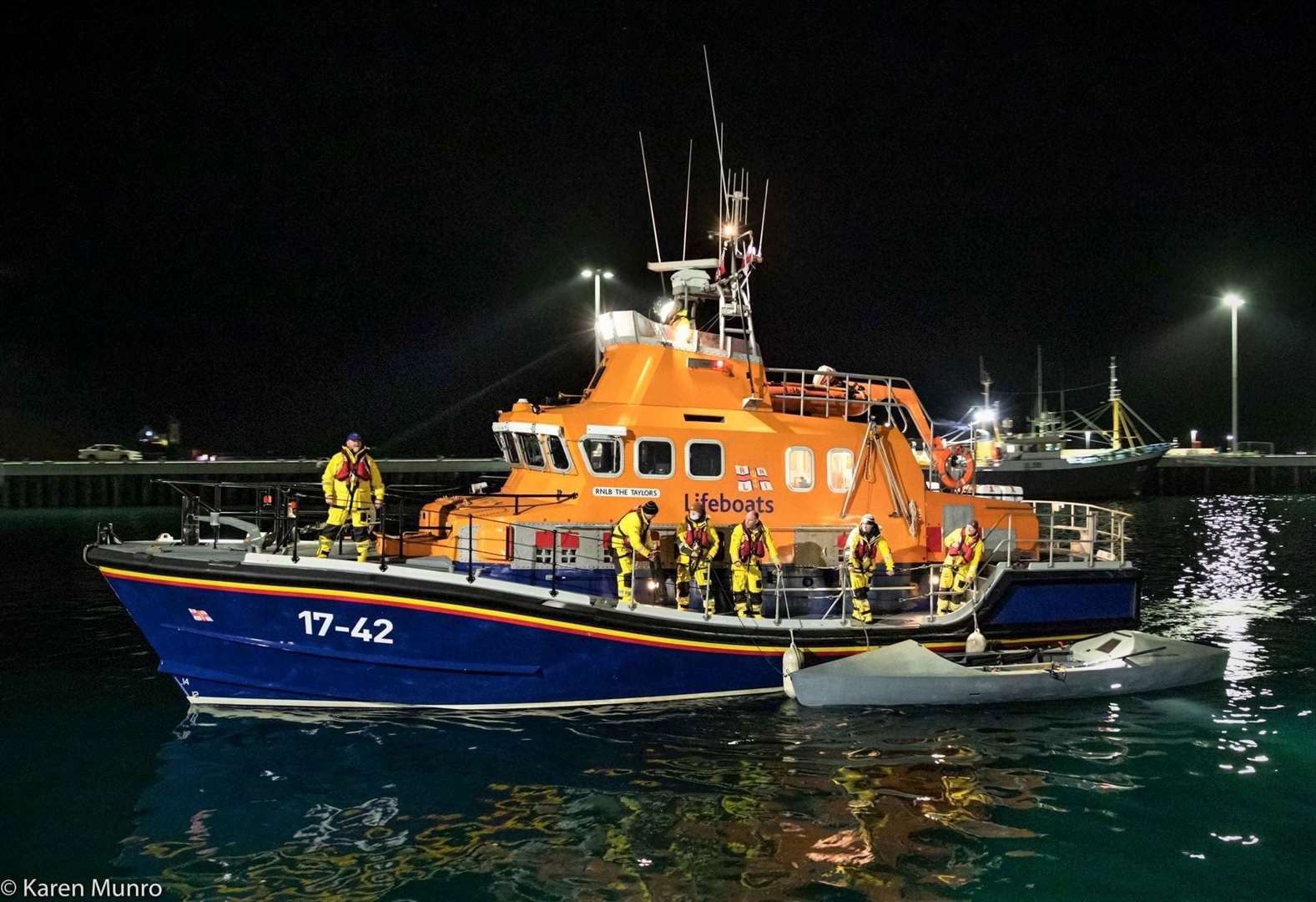 The rescued Atlantic-type vessel can be seen strapped to The Taylors as it arrived in Scrabster last night (Thursday). Picture: Karen Munro