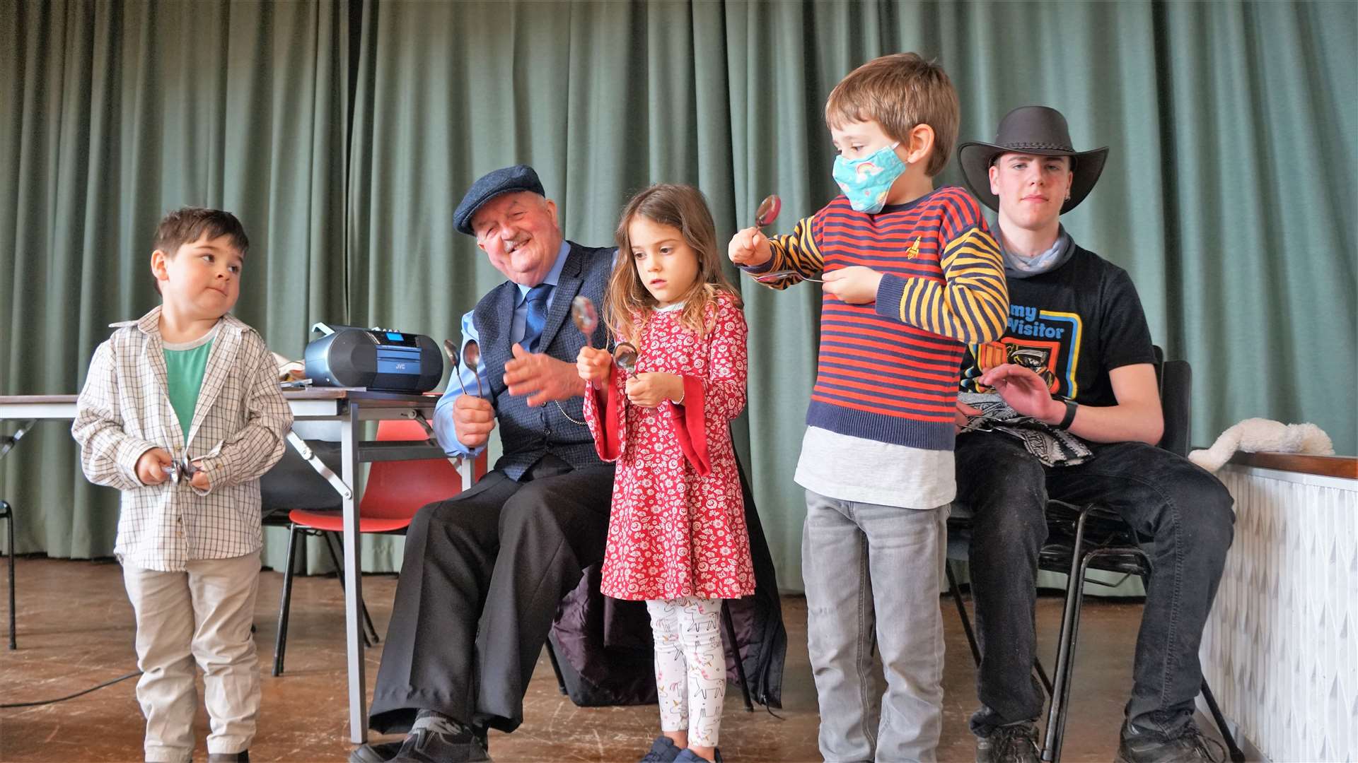 Various children were invited on stage to have a go on the spoons with Willie. Picture: DGS