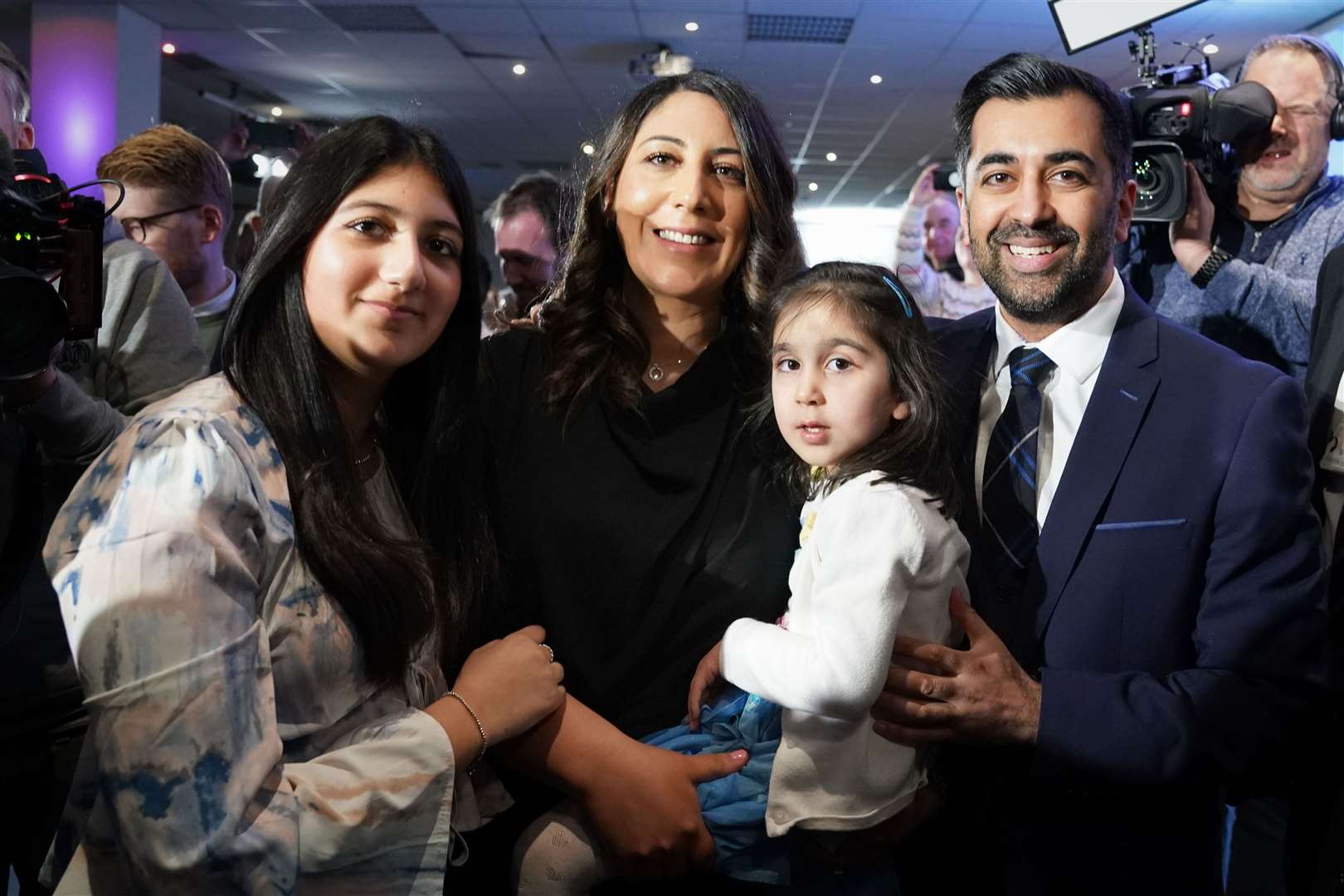 Mr Yousaf with his family after narrowly winning the SNP leadership on Monday (Andrew Milligan/PA)