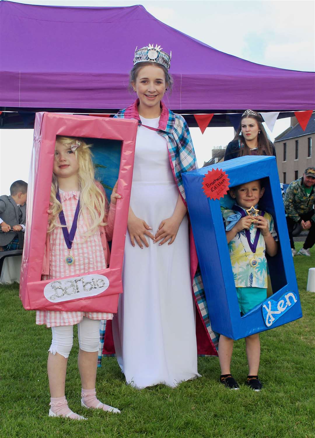 Gala queen Abby Dunbar with Barbie and Ken, Ella Kean (6) and Connor Wilson (5). Picture: Alan Hendry
