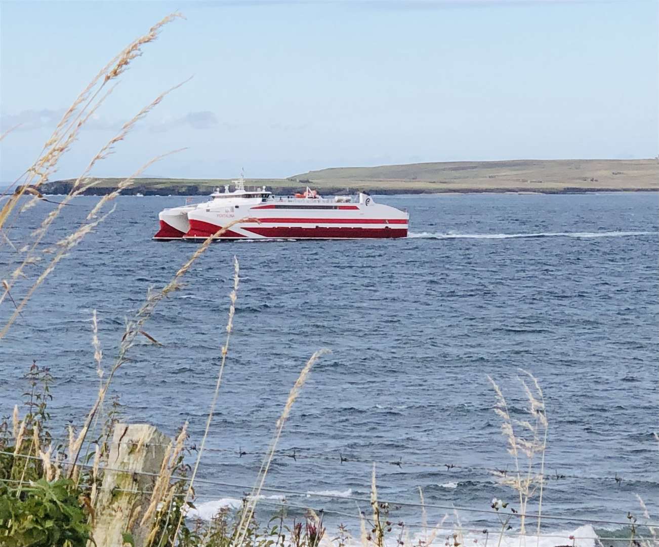 The Pentalina arriving at Gills harbour with Stroma in the background, by Lyall Rennie.