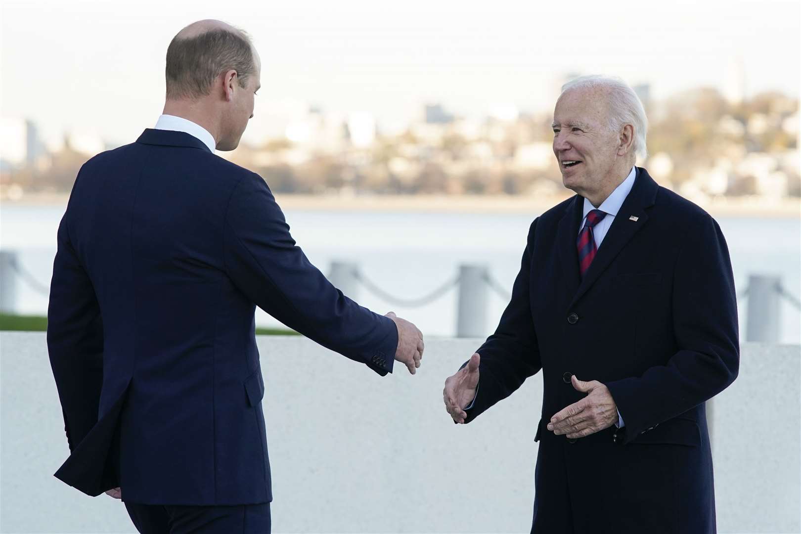 William shakes hands with President Joe Biden as they meet outside the John F. Kennedy Presidential Library and Museum (Patrick Semansky/AP/PA)