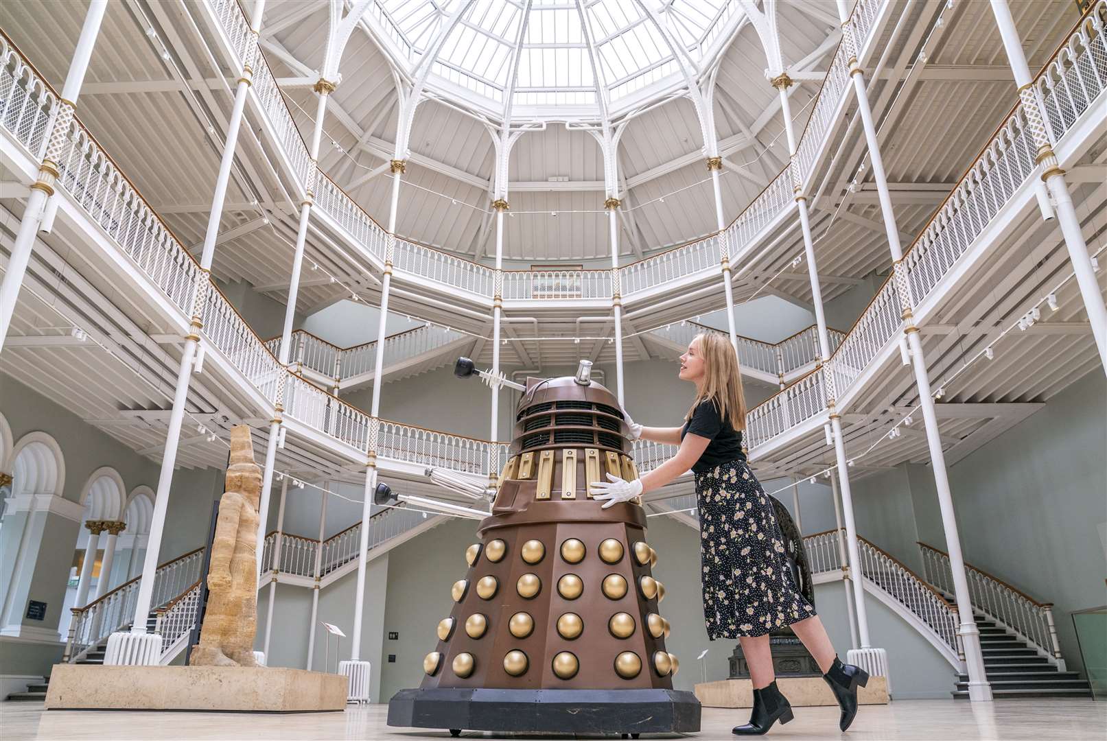 A member of staff pushed a Dalek into place for an exhibition at the National Museum of Scotland in Edinburgh in July (Jane Barlow/PA)