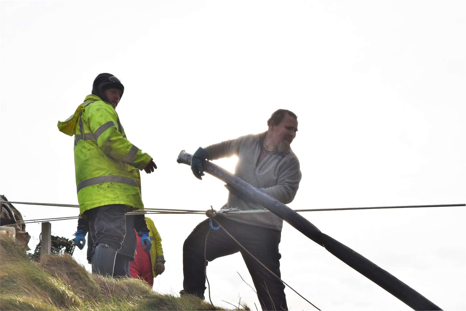 The volunteers set up a Tyrolean traverse line to help remove the discarded creels.