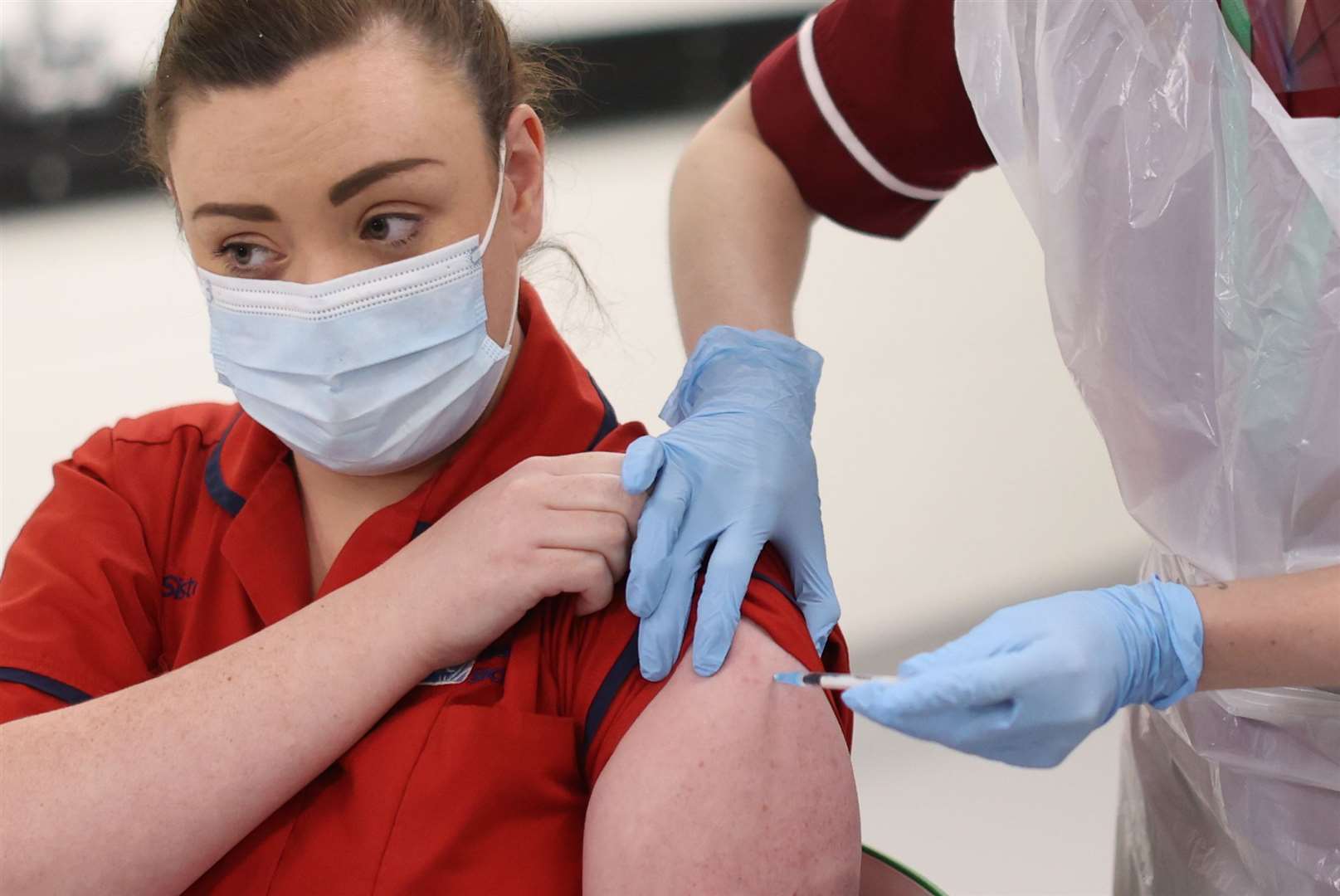 Nurse Joanna Sloan becomes the first person in Northern Ireland to receive the first of two Pfizer/BioNTech Covid-19 vaccine jabs, at the Royal Victoria Hospital, in Belfast on December 8 (Liam McBurney/PA)