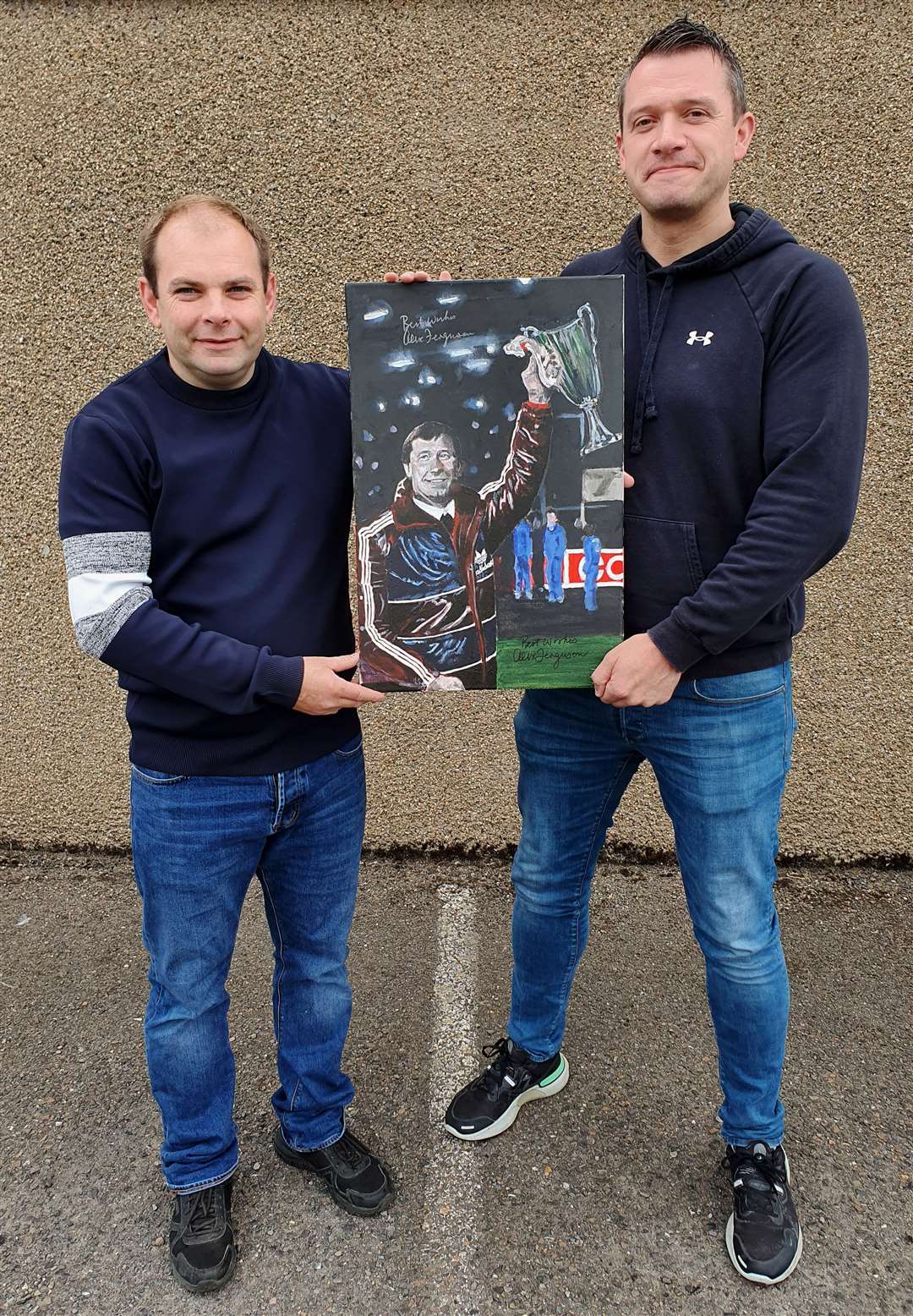 Gary Reid (left) and Thurso artist Davie Greig with the painting of former Aberdeen and Manchester United manager Sir Alex Ferguson.