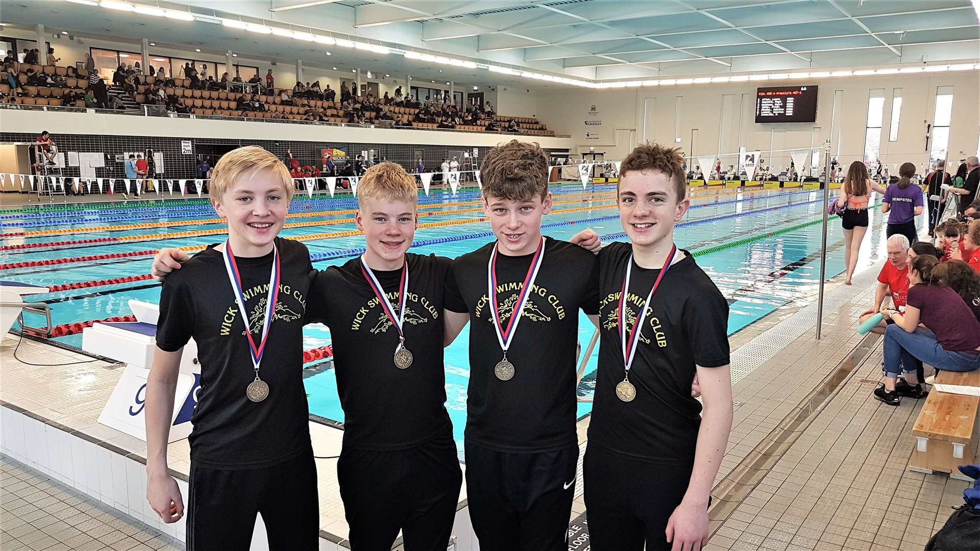 From left: Carter Mackay, Charlie Sutherland, Owen Klimas and Joshua Hughes with their medals from the North District Swimming Championships.