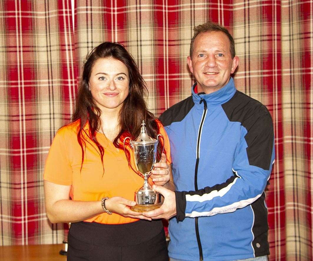 Ladies' scratch club championship winner Eleanor Tunn receiving her trophy from Reay club captain Andy Bain.