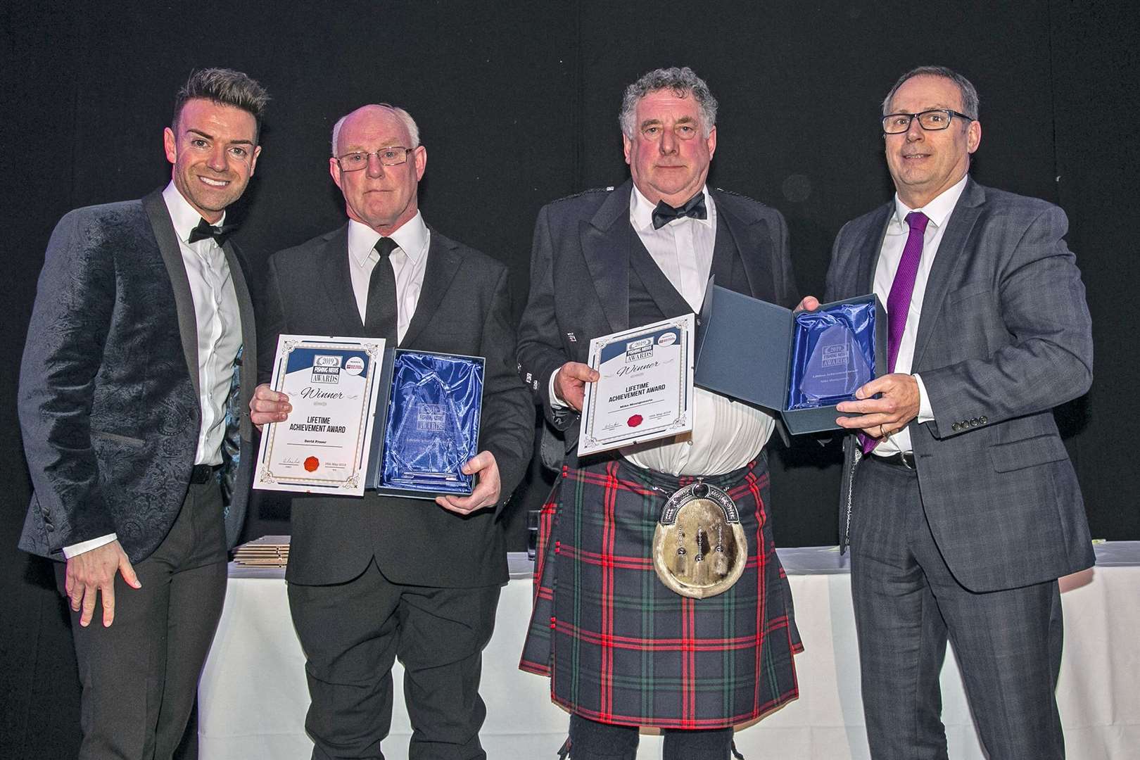 Left to right: Des Clarke, stand-up comedian and presenter who was hosting the awards, skipper David Fraser, joint winner Mike Montgomerie and Mike Park, chief executive of the Scottish White Fish Producers Association and managing director of Box Pool Solutions, the award sponsor.